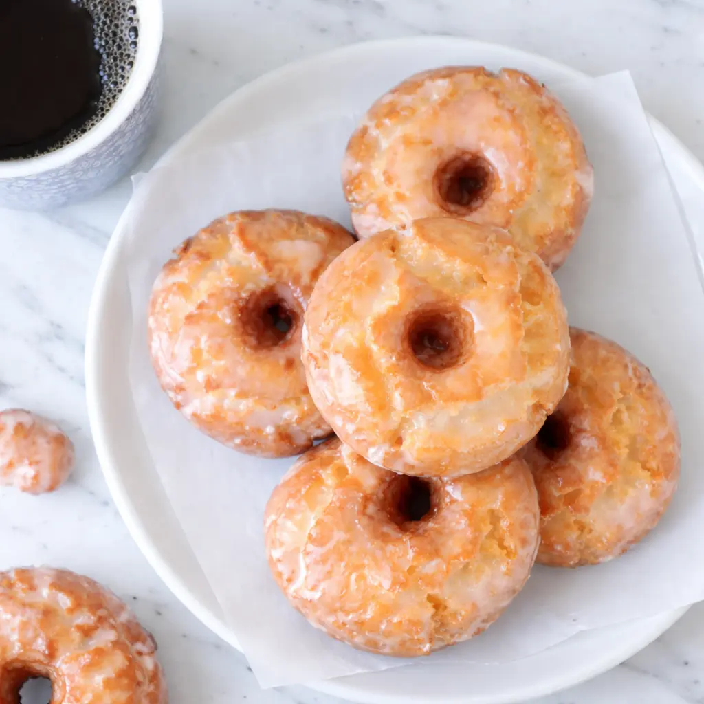 Golden glazed sour cream donuts, crispy outside and soft inside